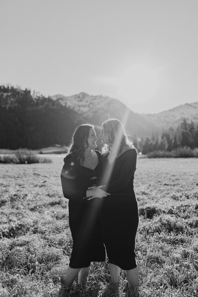palisades tahoe engagement photoshoot with mountains and forest in the background