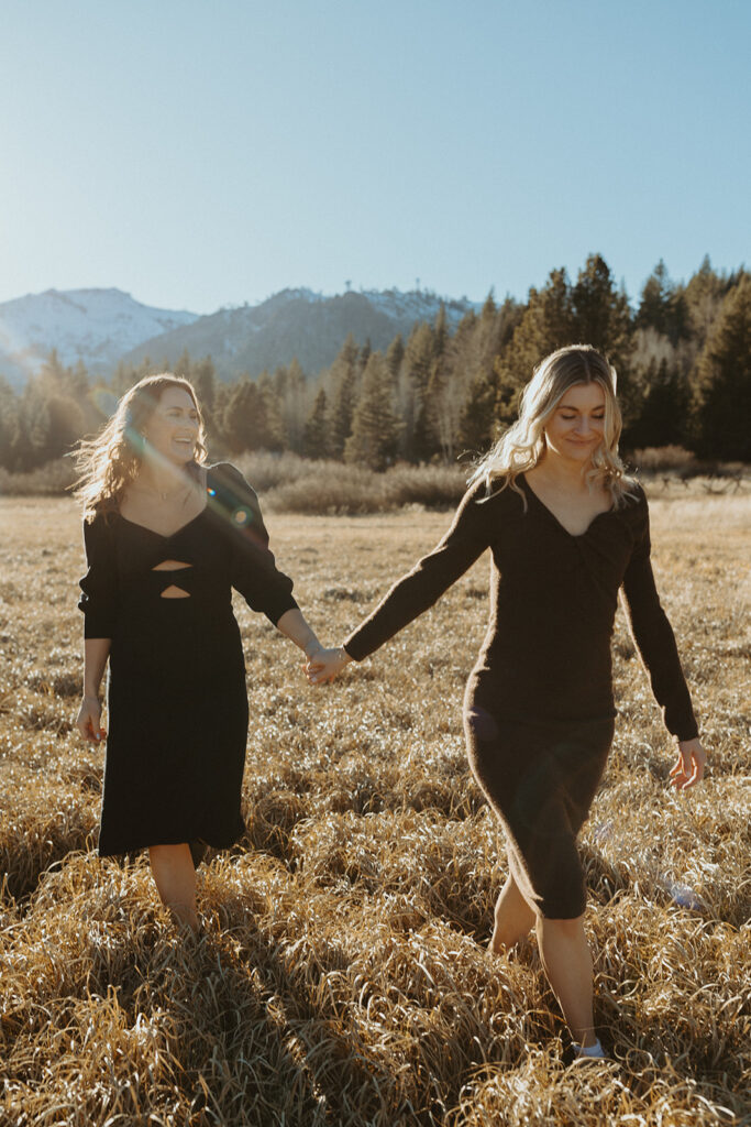 palisades tahoe engagement photoshoot with mountains and forest in the background
